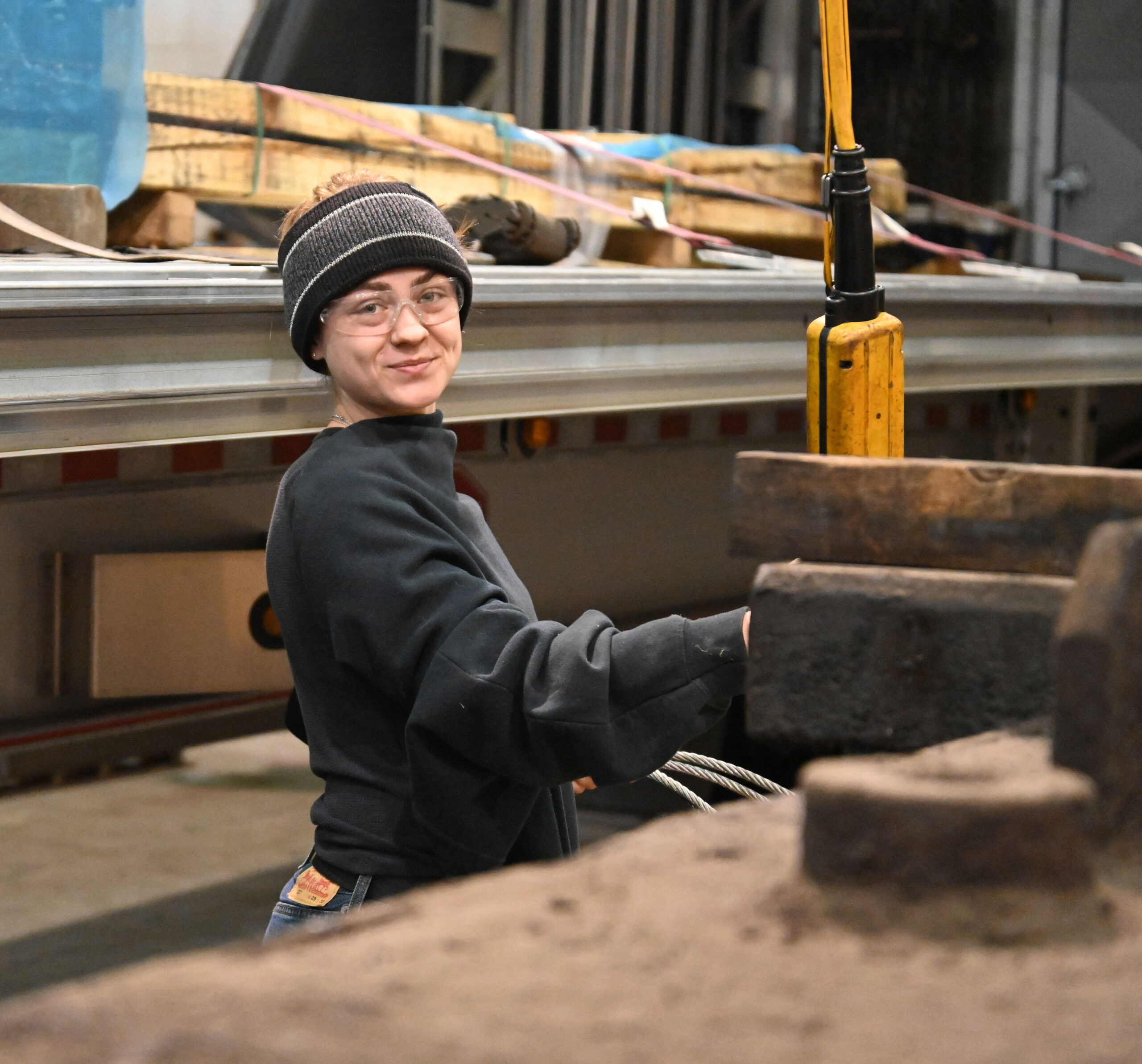 M-7 Technologies technician looking at the camera holding a control that comes from the ceiling