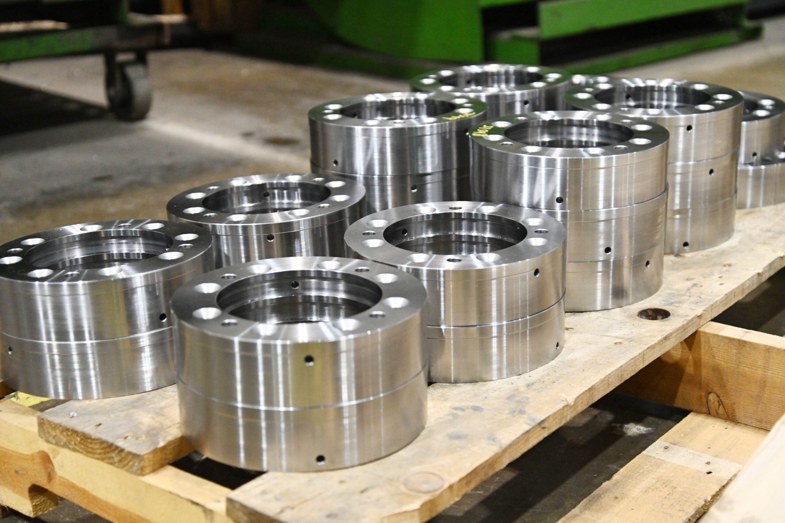 Round metal pieces stacked on a pallet